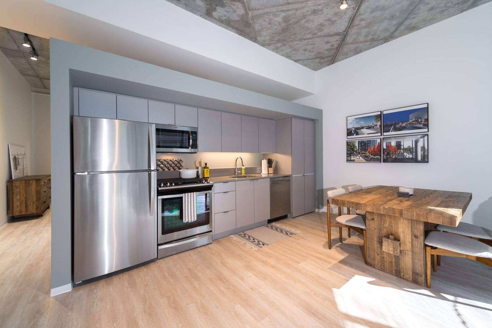Modern kitchen with wooden dining table.