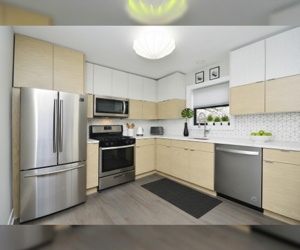 Modern kitchen with stainless steel appliances.