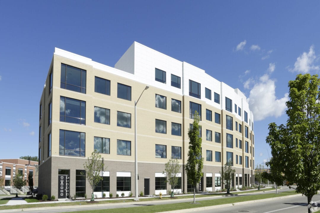 Modern office building under clear blue sky.