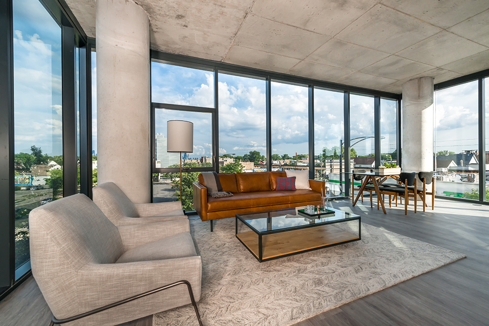 Modern apartment with panoramic windows and stylish furniture.