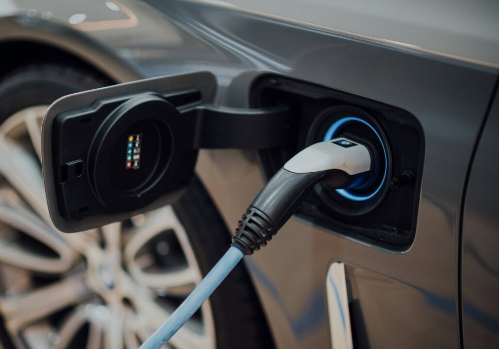 Electric car charging at station close-up