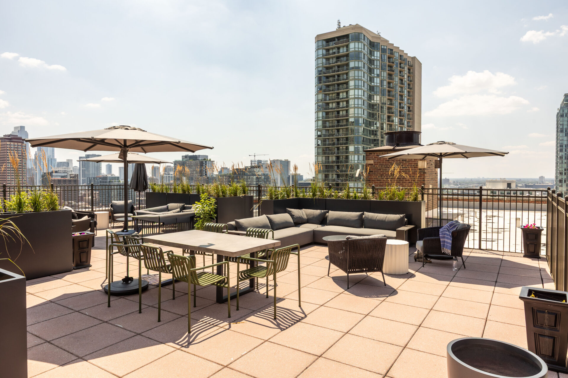 Modern rooftop terrace with city skyline views and outdoor seating