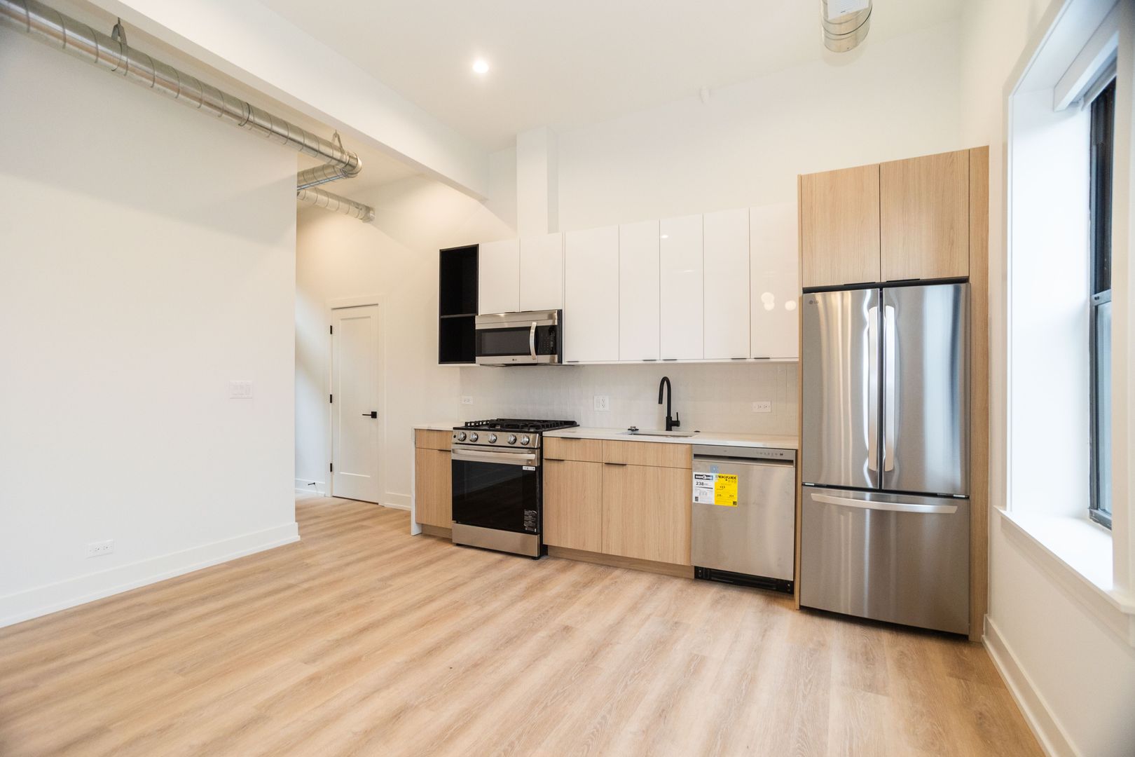 Modern open-concept kitchen with stainless steel appliances